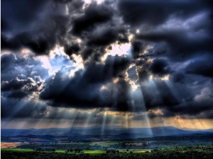 Rays of sunlight through storm clouds